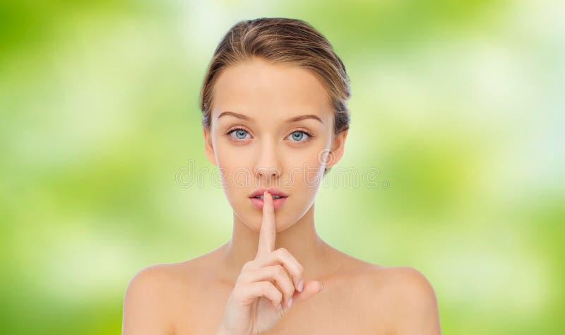 Beautiful Young Woman Holding Finger On Lips Stoc picture pic