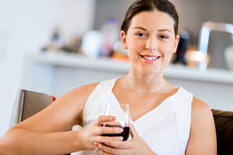 Beautiful young woman holding glass with red wine stock image Beautiful young woman holding glass with red wine stock image