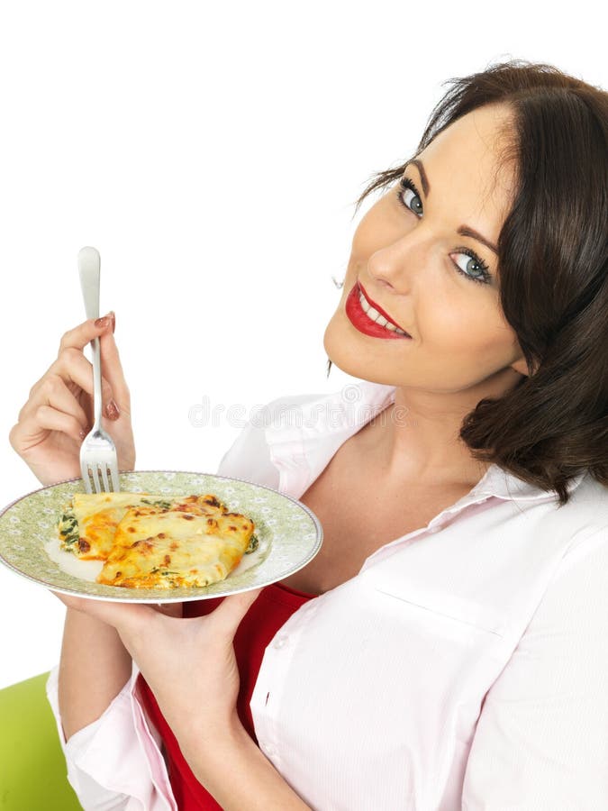 Beautiful Young Woman Holding a Plate of Cannelloni and Spinach Pasta