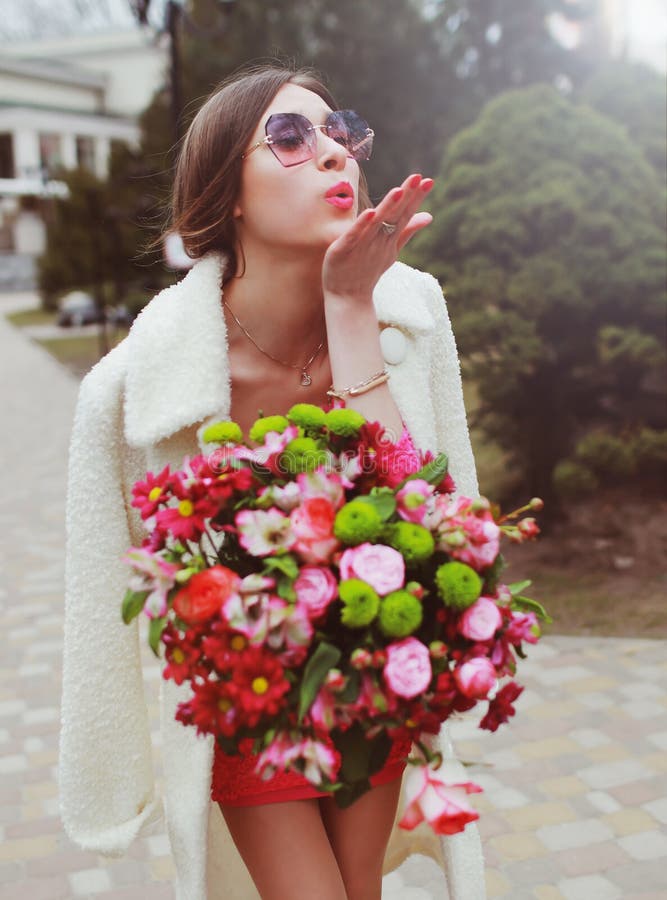 Beautiful Young Woman with a Large Bouquet of Flowers Stock Photo ...