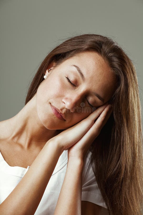 Beautiful woman, long hair, sleeping gesture