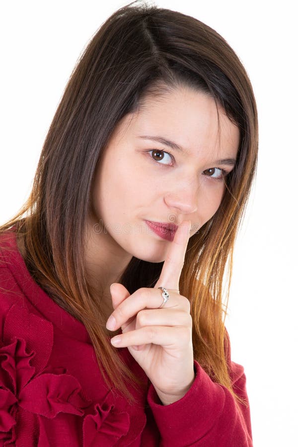 Beautiful young woman with long hair shows hush sign has serious expression asks not to tell her secret anybody shh hopes for stock photography Beautiful young woman with long hair shows hush sign has serious expression asks not to tell her secret anybody shh hopes for stock photography