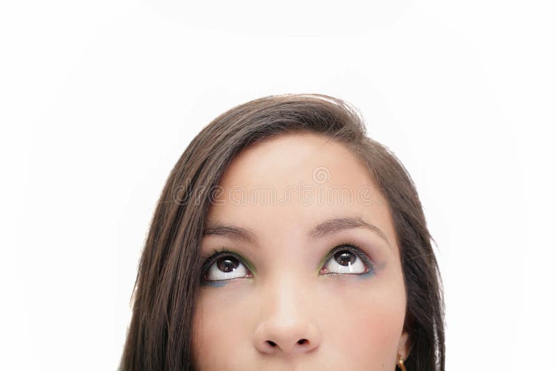 Beautiful young woman looking up