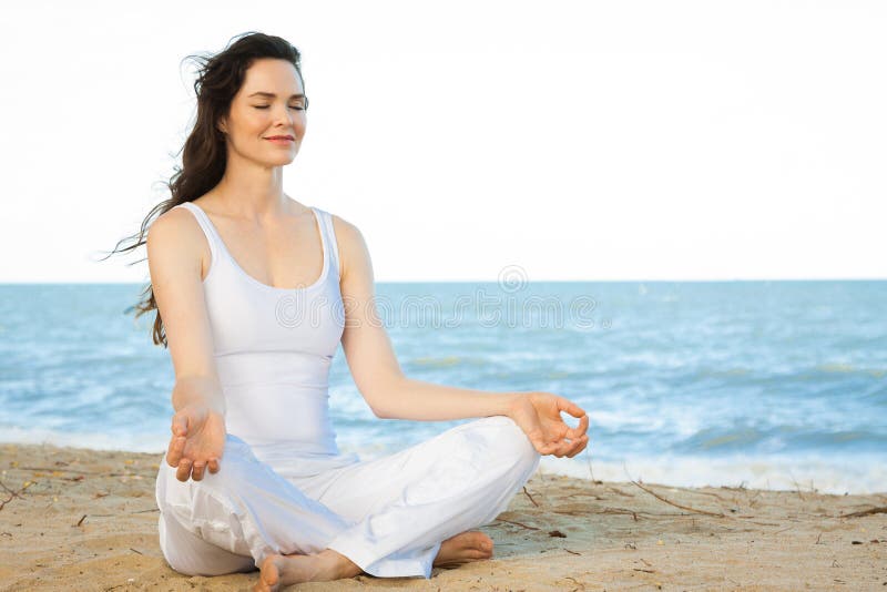 Beautiful young woman meditating