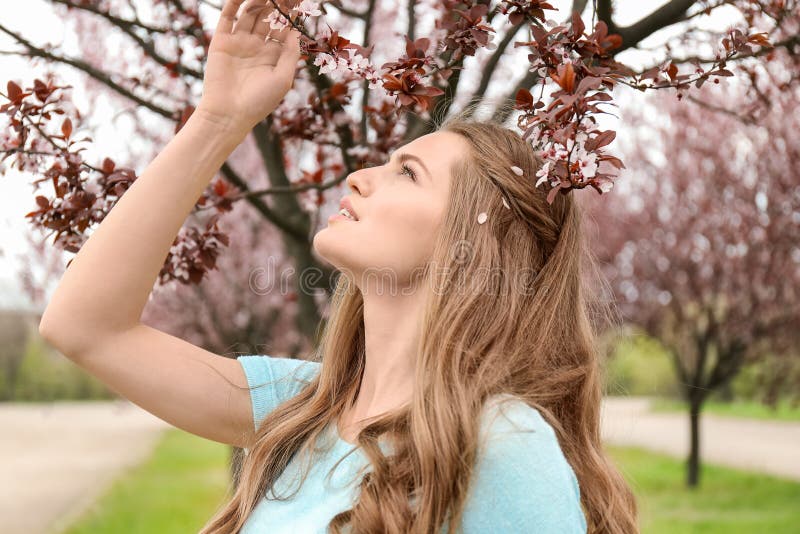 Beautiful Young Woman Near Blossoming Tree On Spring Day Stock Image