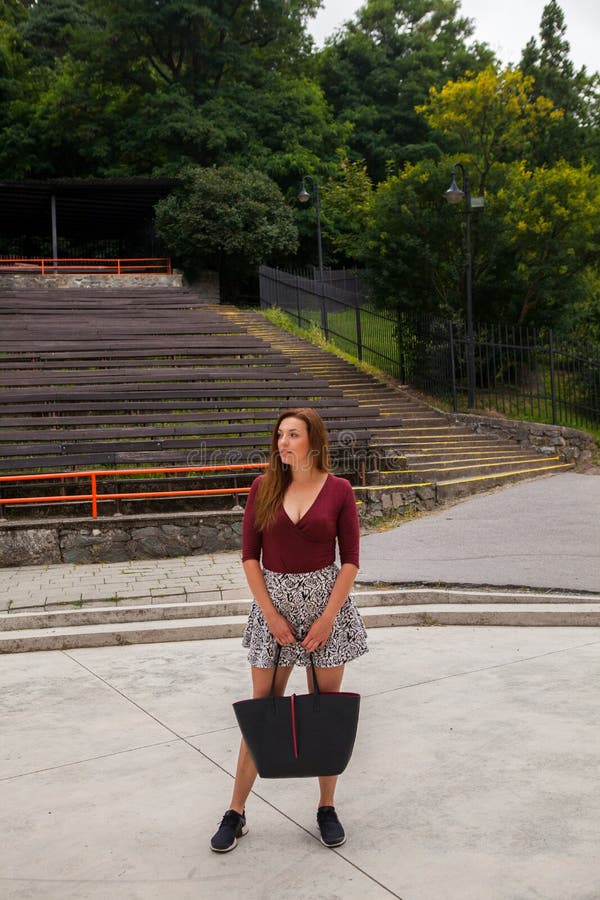 Beautiful young woman in the outdoor theater