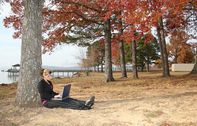 Beautiful Young Woman at Park with Laptop