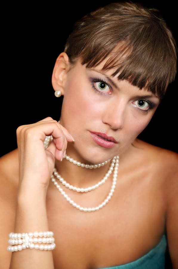 Beautiful young woman with pearls