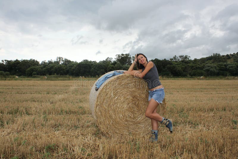 A Beautiful Young Woman Is Posing In The Field Stock Image Image Of