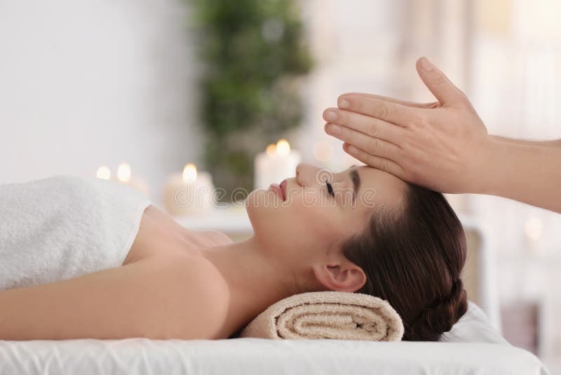 Beautiful young woman receiving facial massage stock photography Beautiful young woman receiving facial massage stock photography