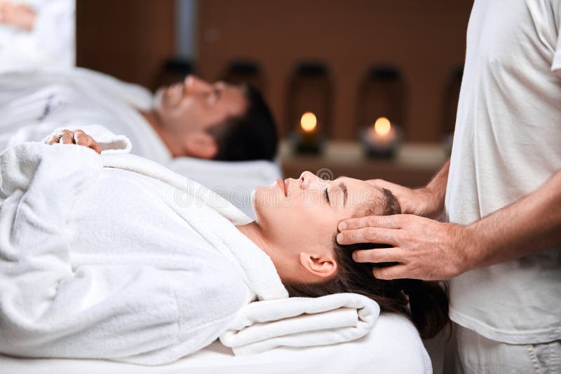 Beautiful Young Woman Receiving Massage On Head And Shoulders Zone In