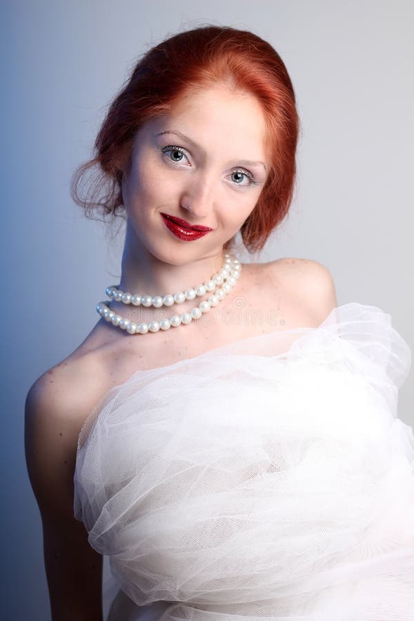 Beautiful young woman with red hair bride