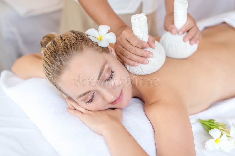 Beautiful young woman relaxing with hand massage at beauty spa. Thai body massage. Closed up of young beautiful woman getting spa stock photos Beautiful young woman relaxing with hand massage at beauty spa. Thai body massage. Closed up of young beautiful woman getting spa stock photos