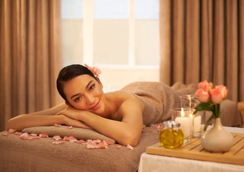 Rejuvenate And Revive A Beautiful Young Woman Relaxing On A Massage Table Before Her Massage