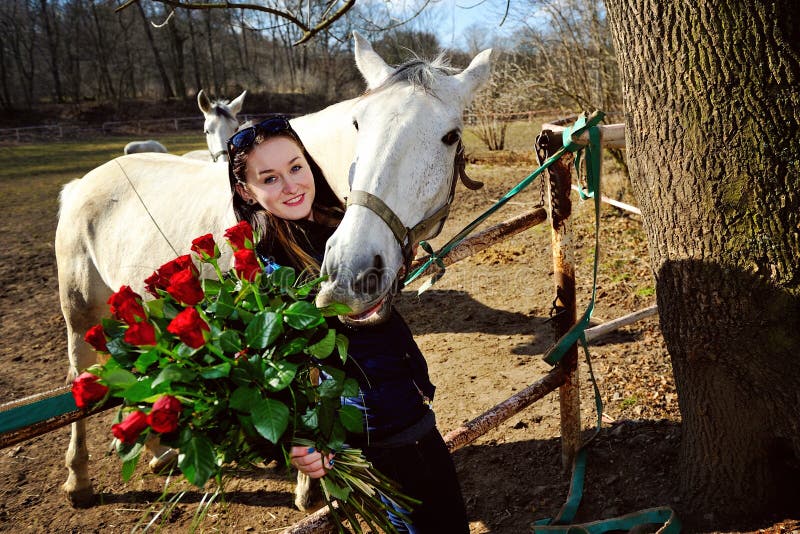 Beautiful young woman with roses and white horse stock images Beautiful young woman with roses and white horse stock images