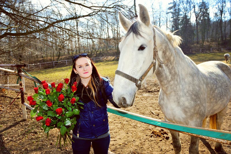 Beautiful young woman with roses and white horse royalty free stock photos Beautiful young woman with roses and white horse royalty free stock photos