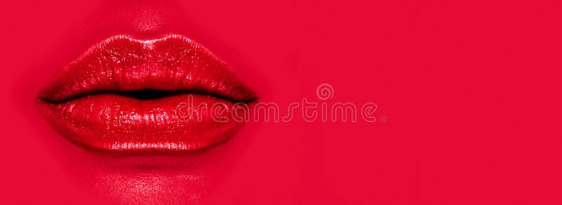 Beautiful young woman`s lips closeup, on red background. Plastic surgery, fillers, injection. Part of the model girl face