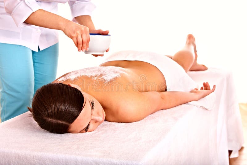 Beautiful young woman scrubbing body. stock images