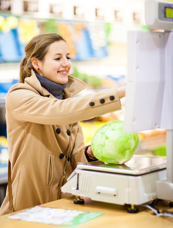 Beautiful young woman shopping for fruits and vegetables