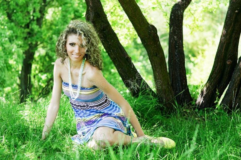 Beautiful young woman sitting on