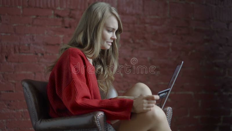 seductive woman in sexy underwear looking at man sitting on sofa and taking  off clothing isolated on Stock Photo by LightFieldStudios