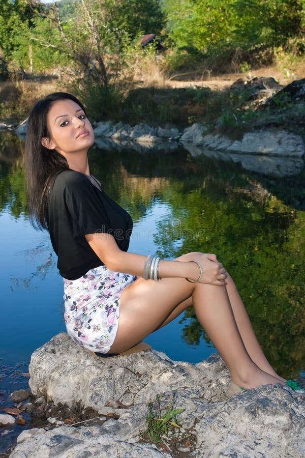 Beautiful Young Woman Sitting by the River Stock Image - Image of ...