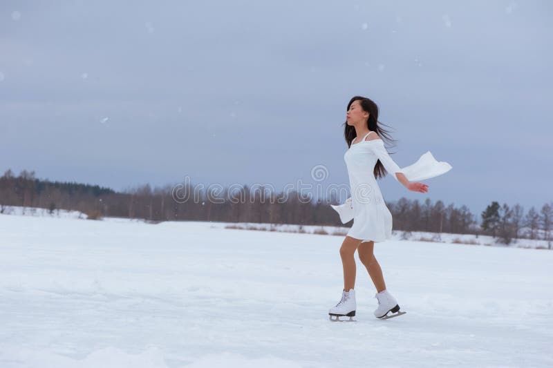 Beautiful young woman on skates