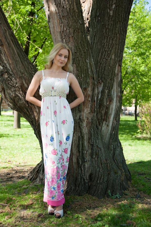 Beautiful, Young Woman Standing Near the Tree Stock Image - Image of ...