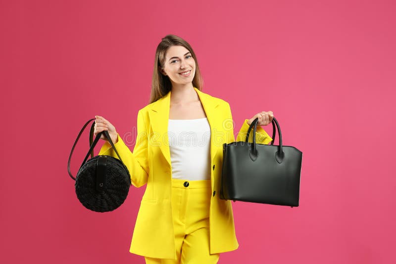 Beautiful Young Woman With Stylish Bags On Background Stock Photo ...