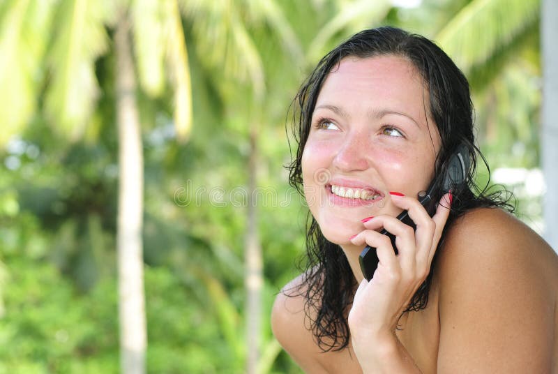 Beautiful young woman talking on cellphone