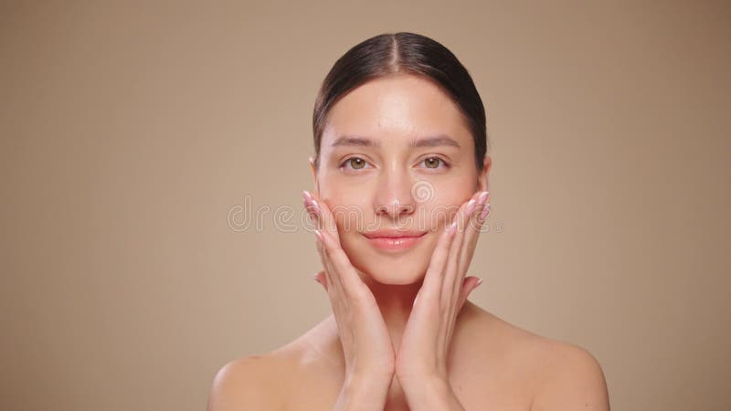 Beautiful Young Woman Touches Her Perfect Face