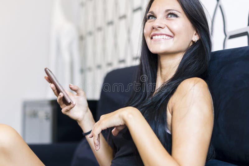 Beautiful young woman using phone royalty free stock photo