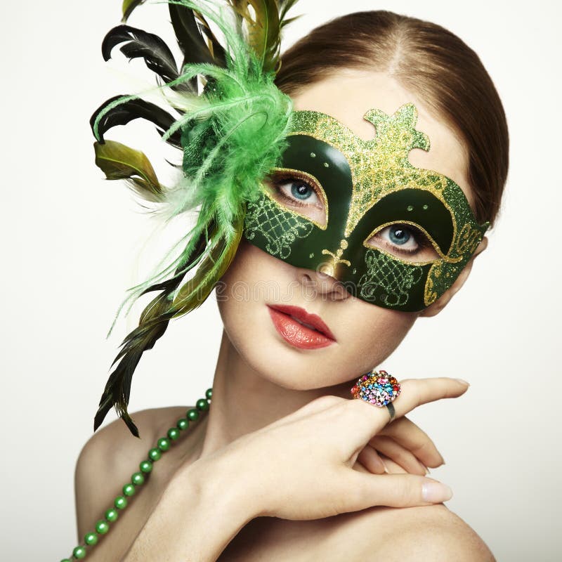 The beautiful young woman in a venetian mask