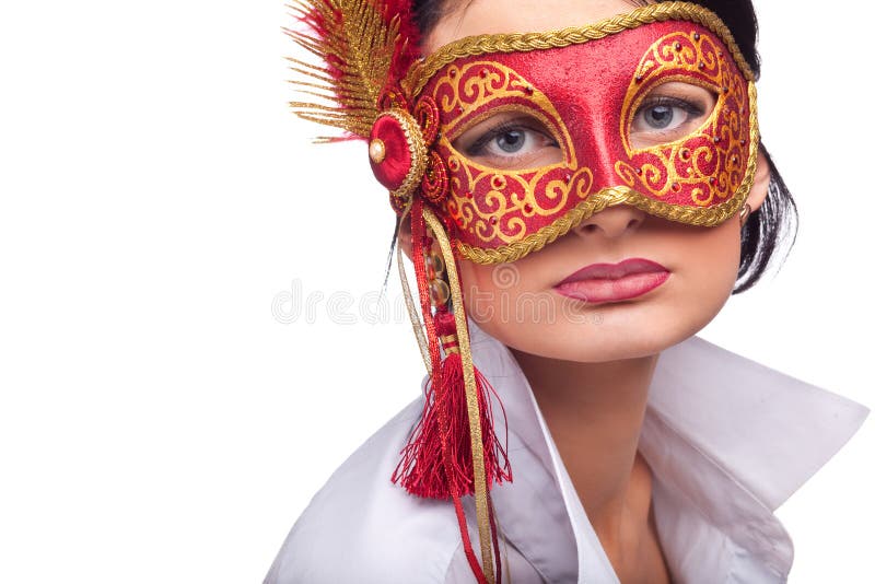 Beautiful young woman wearing red carnival mask