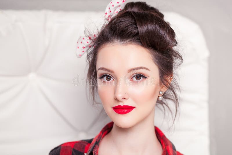 Beautiful young woman on white background in old fashion clothes representing pinup and retro style stock photos Beautiful young woman on white background in old fashion clothes representing pinup and retro style stock photos