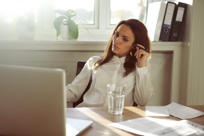 Beautiful young woman working from home