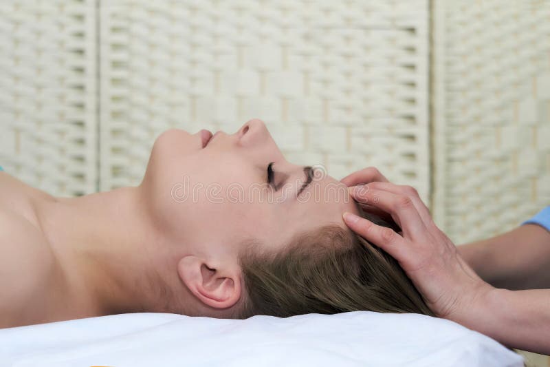 Beautiful Young Woman Getting Facial Massage In The Spa Salon Close Up