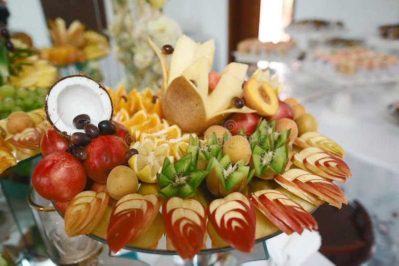 Beautifully decorated catering banquet table with different fresh fruits on corporate birthday party event or wedding celebration. stock images Beautifully decorated catering banquet table with different fresh fruits on corporate birthday party event or wedding celebration. stock images