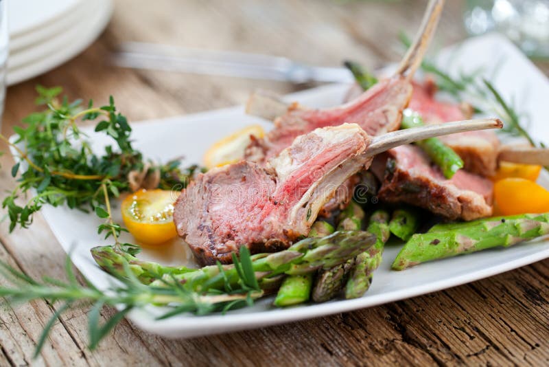 Beautifully Grilled Lamb Rib Chop Steaks, Medium Rare . Stock Photo
