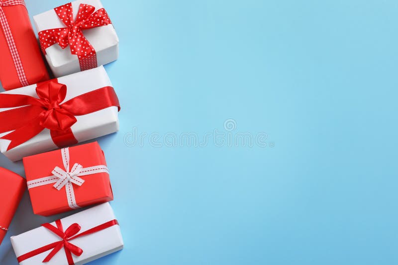 Beautifully wrapped gift boxes on color background stock image Beautifully wrapped gift boxes on color background stock image