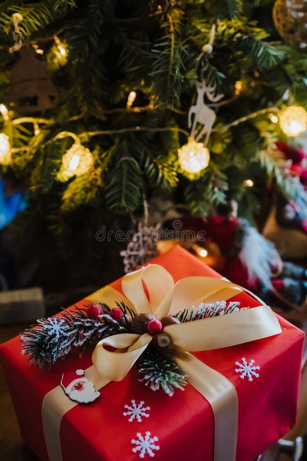 Beautifully Wrapped Red Gift Box Under the Christmas Tree, Top View