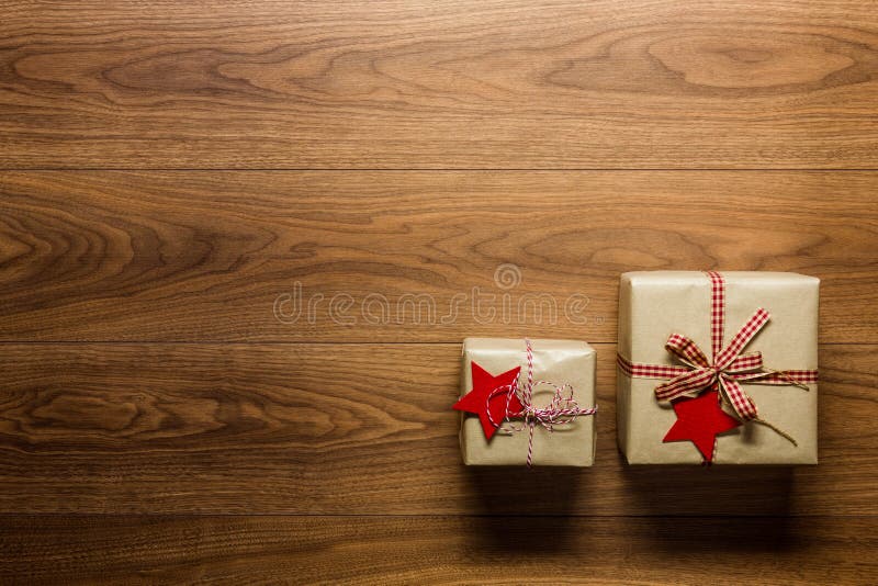 Beautifully wrapped vintage christmas presents on wooden background, view from above stock image