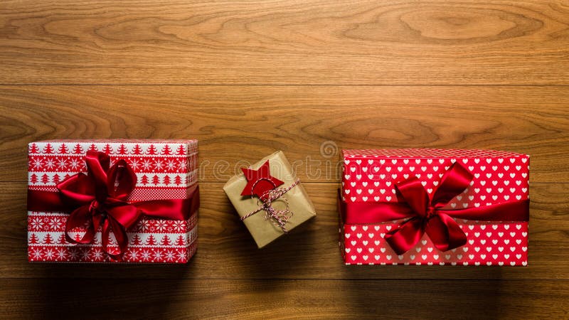 Beautifully wrapped vintage christmas presents on wooden background, view from above royalty free stock images