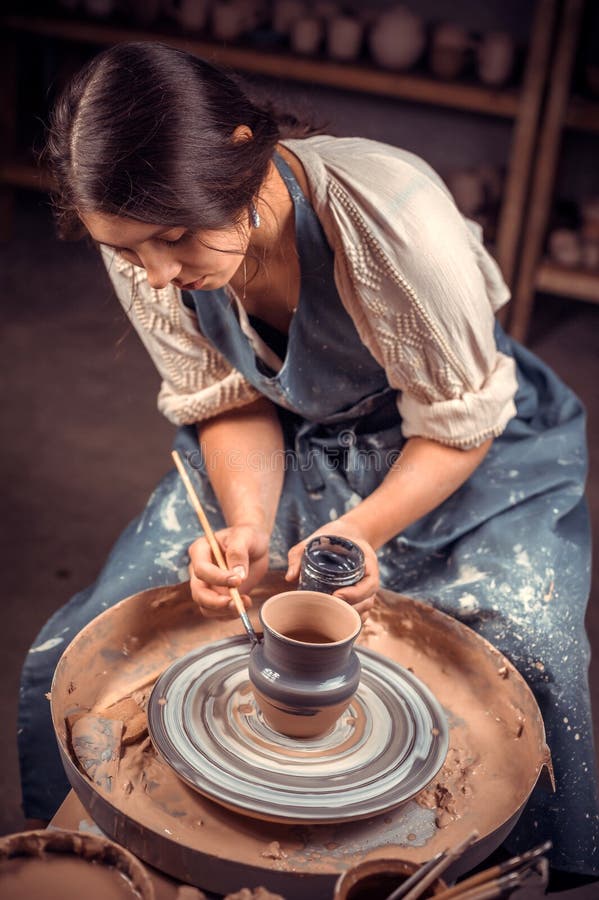 Stylish Pottery Woman Siting on Bench with Pottery Wheel and Making Clay  Pot. National Craft. Stock Photo - Image of handicrft, shape: 147147962