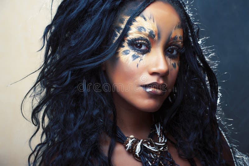 Beauty afro girl with cat make up, creative leopard print closeup, fashion style halloween look