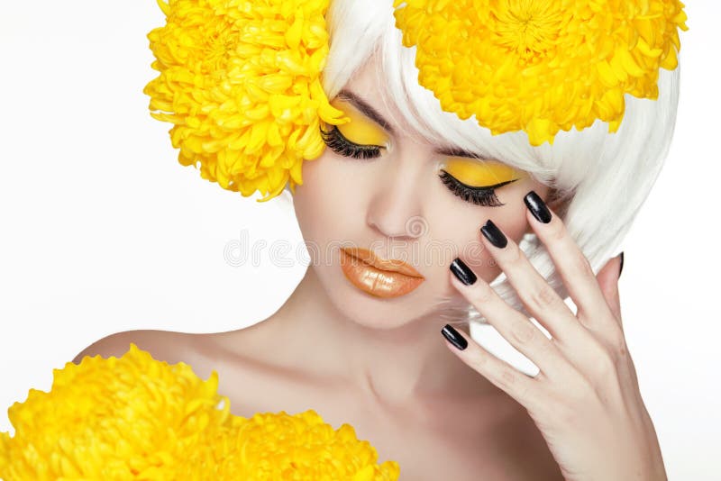 Beauty Blond Female Portrait with yellow flowers. Beautiful Spa