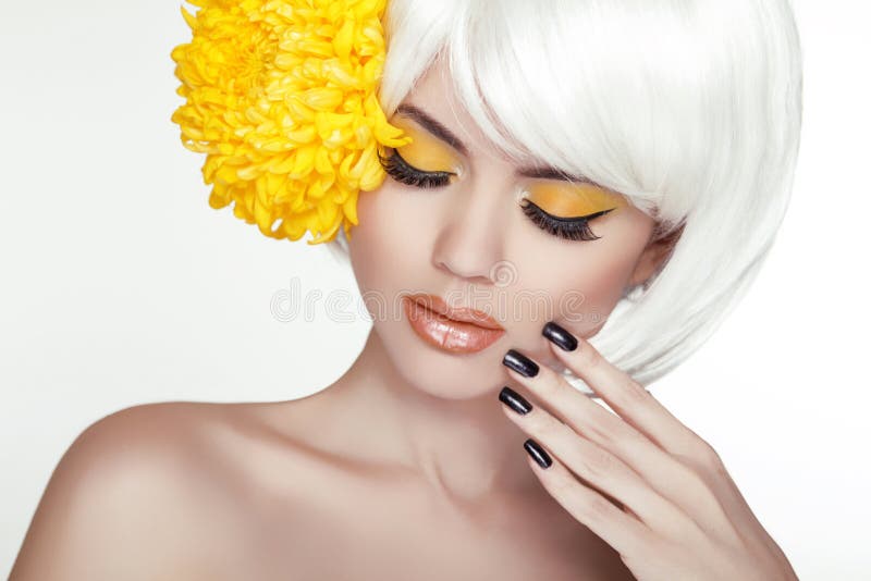 Beauty Blond Female Portrait with yellow flowers. Beautiful Spa