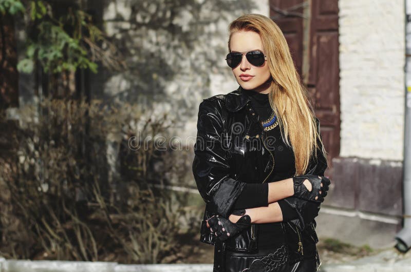 Beauty blond girl in leather jacket