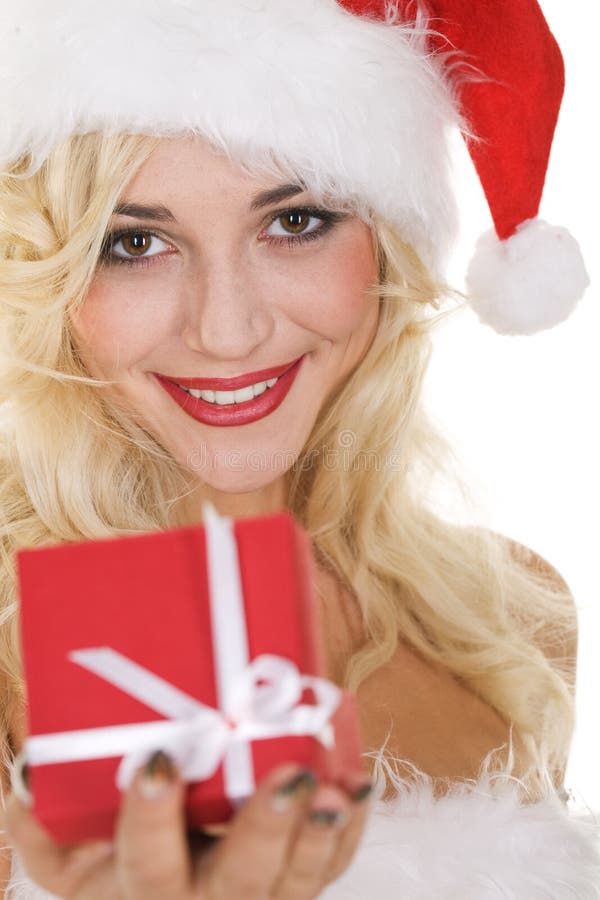 Beauty blonde girl in santa hat with gift