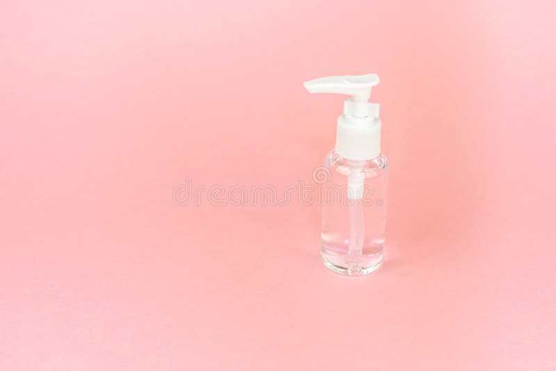 Beauty cosmetics glassbottle; branding mock up; front view on pastel pink background. stock image Beauty cosmetics glassbottle; branding mock up; front view on pastel pink background. stock image